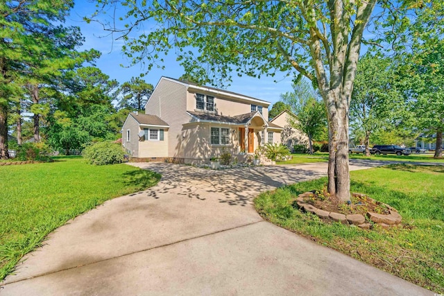 3763 Annandale Dr, Myrtle Beach, SC 29577 - traditional-style house with a front lawn and curved driveway