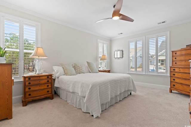 bedroom featuring light carpet, visible vents, and crown molding