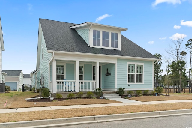 view of front of home with central air condition unit, a porch, and a shingled roof