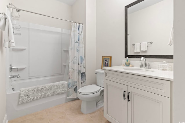 bathroom featuring tile patterned floors, toilet, vanity, and shower / bath combo