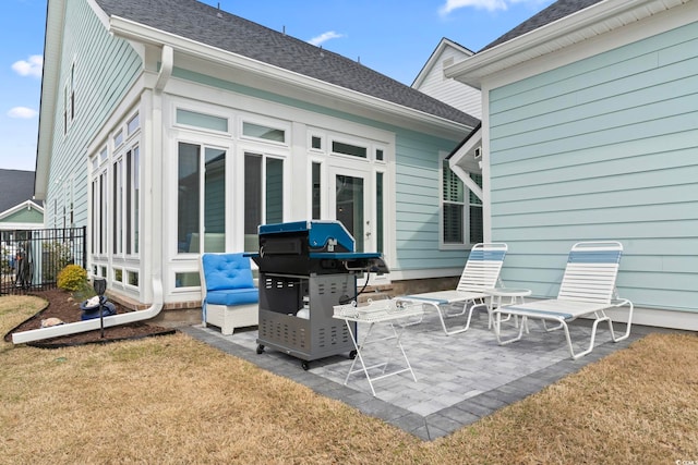 view of patio / terrace featuring grilling area and fence