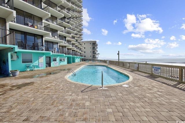 community pool with a water view