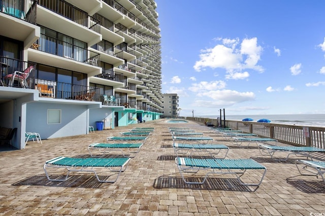 view of pool with a water view