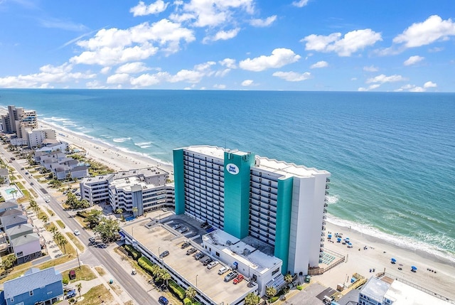 aerial view featuring a view of the beach and a water view