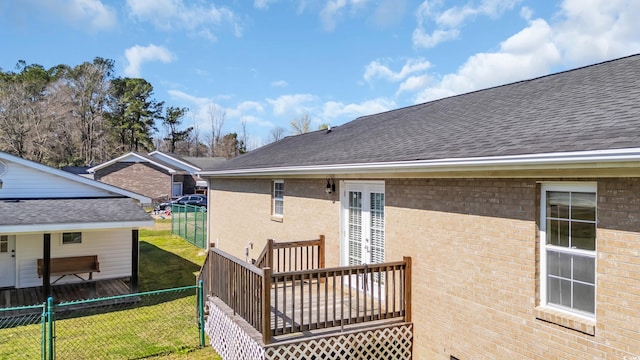 4938 Trooper Ln, Loris, SC 29569 - back of property with a shingled roof, brick siding, and a deck