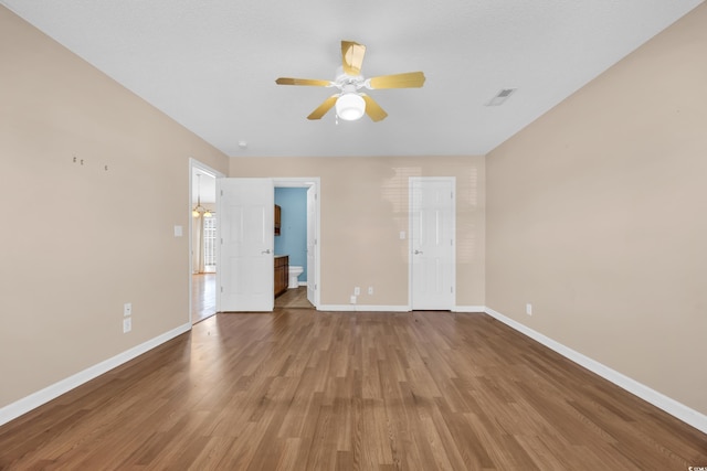 4938 Trooper Ln, Loris, SC 29569 - unfurnished room featuring baseboards, wood finished floors, and a ceiling fan