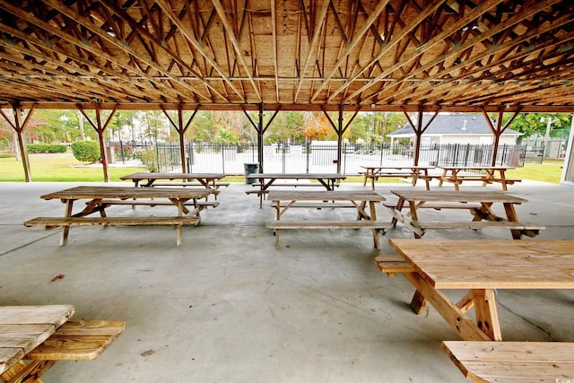 surrounding community featuring a patio area and fence