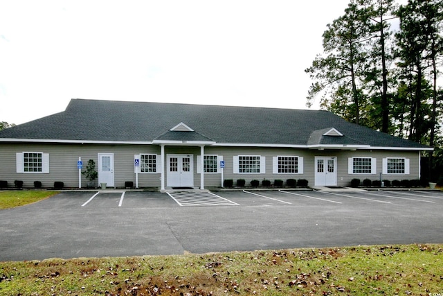 view of property featuring uncovered parking