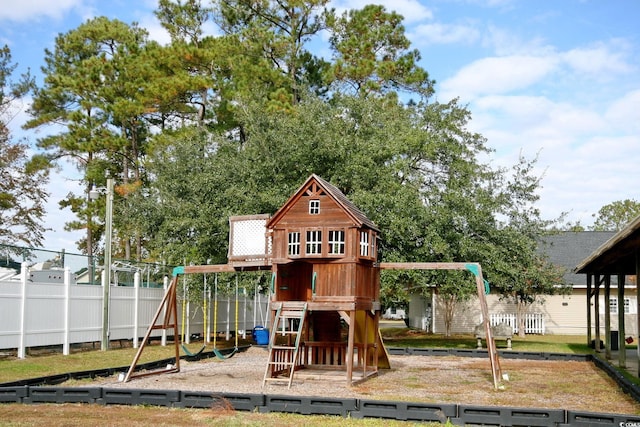 view of jungle gym with fence