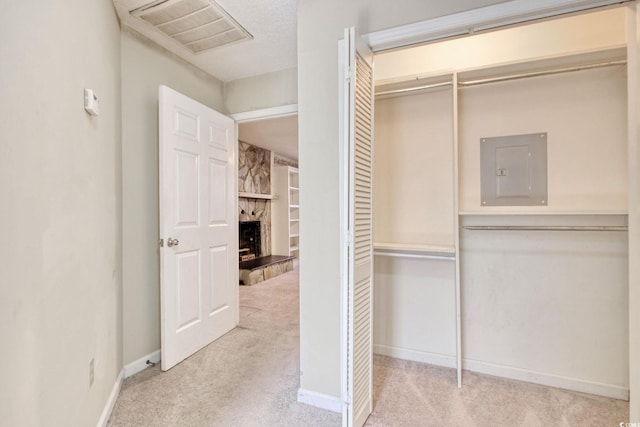 closet with electric panel and visible vents