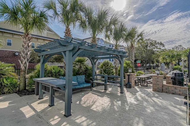 surrounding community with fence, a patio area, and a pergola