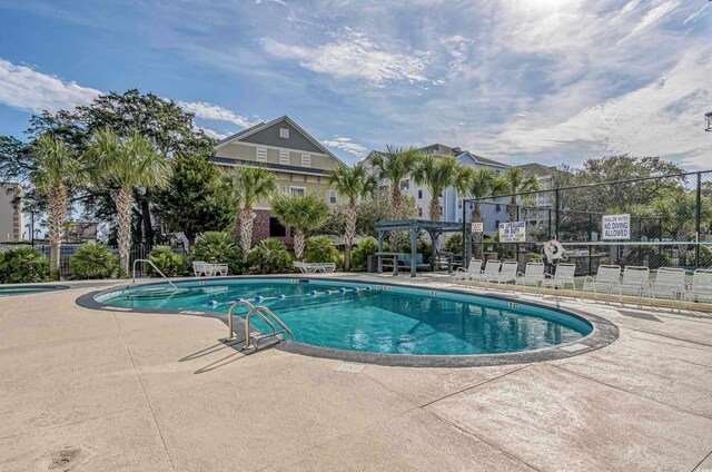 601 Mitchell Dr Unit 203, Myrtle Beach, SC 29577 - community pool with a patio area and a pergola