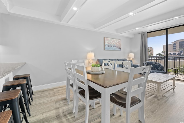 dining area featuring recessed lighting, beamed ceiling, baseboards, and light wood-style flooring