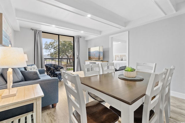 dining area with beamed ceiling, recessed lighting, baseboards, and light wood-type flooring