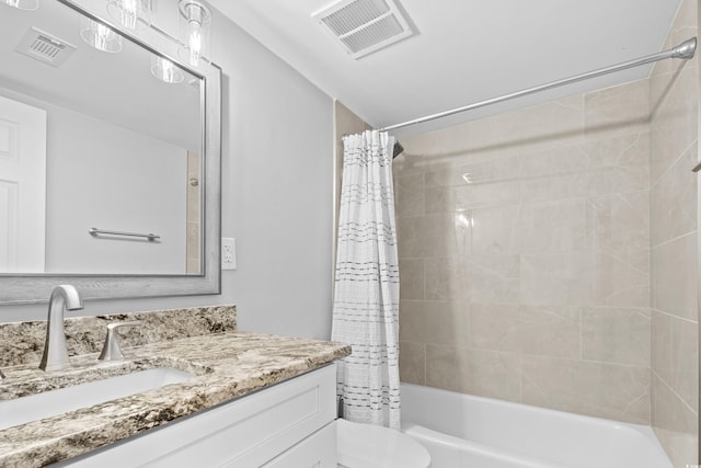 full bath featuring vanity, shower / tub combo, toilet, and visible vents