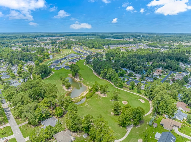 aerial view featuring golf course view, a water view, and a residential view