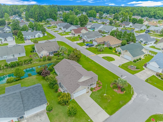 birds eye view of property featuring a residential view and a water view