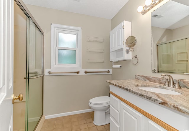 full bath with visible vents, toilet, a stall shower, and vanity