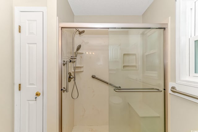 bathroom featuring a shower stall