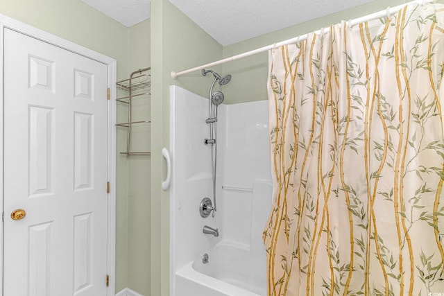 full bath featuring shower / tub combo and a textured ceiling