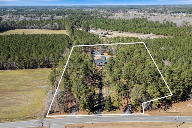 aerial view with a wooded view