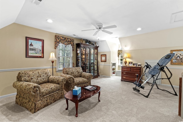 carpeted living area with vaulted ceiling, visible vents, baseboards, and ceiling fan