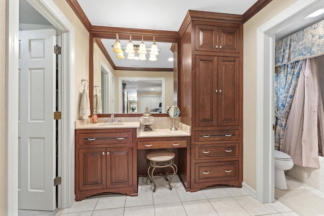 bathroom with vanity, crown molding, toilet, and tile patterned floors