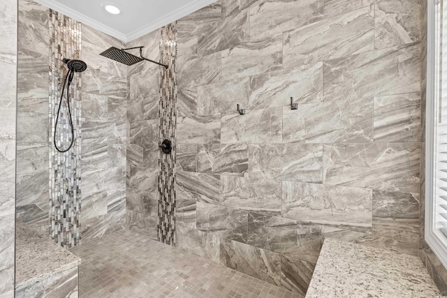 bathroom with tiled shower and ornamental molding