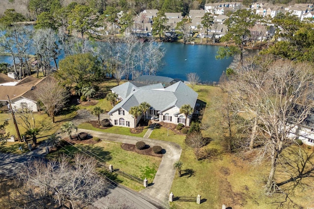 birds eye view of property with a residential view and a water view