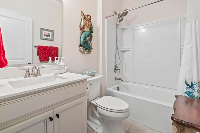 full bathroom featuring tile patterned floors, toilet, vanity, and shower / bathtub combination with curtain