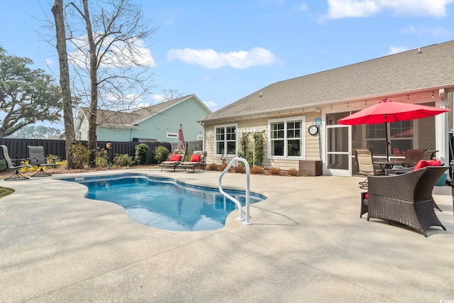 view of swimming pool featuring a patio area, a fenced in pool, and a fenced backyard