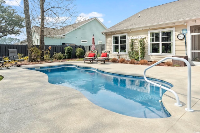 view of pool featuring a patio area, a fenced in pool, and a fenced backyard