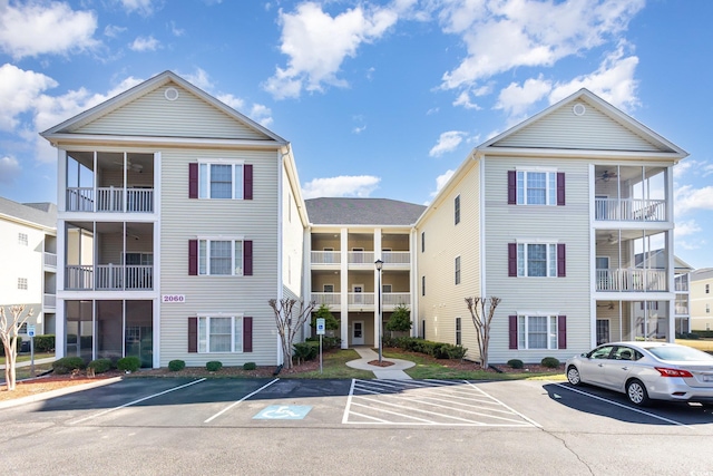 view of property featuring uncovered parking