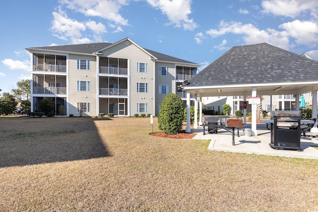 exterior space featuring a gazebo and a lawn