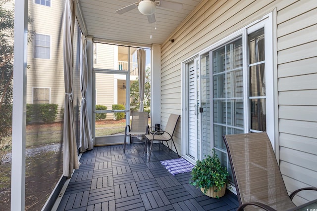 sunroom / solarium with ceiling fan