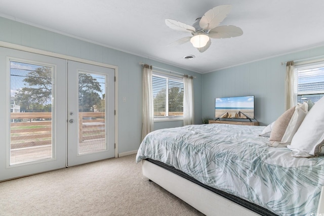 carpeted bedroom featuring french doors, visible vents, access to exterior, and crown molding