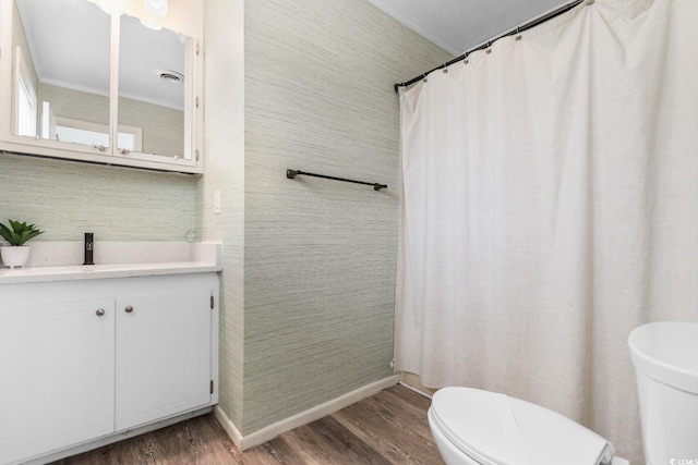 full bathroom with visible vents, toilet, and wood finished floors