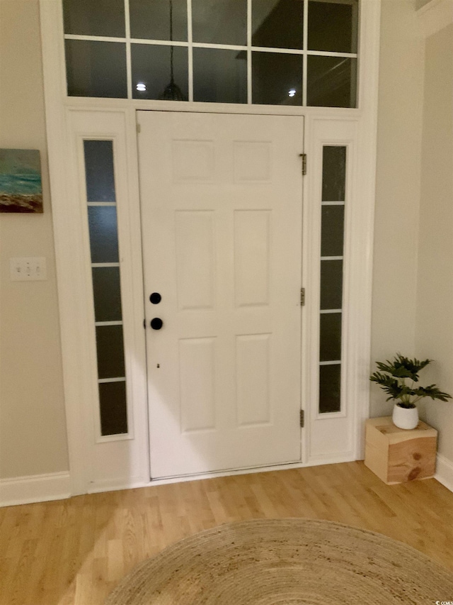 entrance foyer featuring baseboards and light wood-style flooring