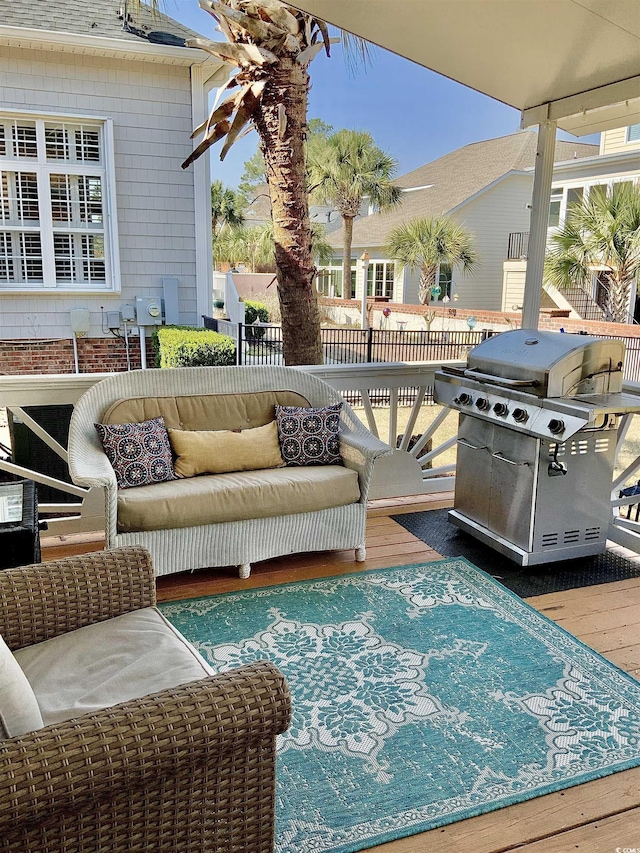 view of patio / terrace with a grill, an outdoor hangout area, and fence