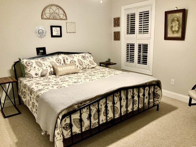 carpeted bedroom with baseboards