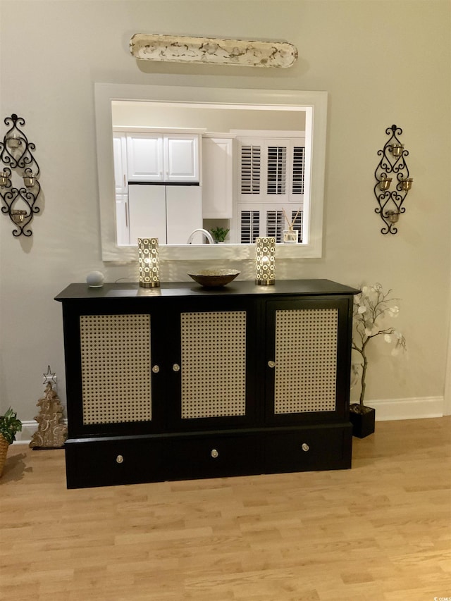 details featuring baseboards and wood finished floors