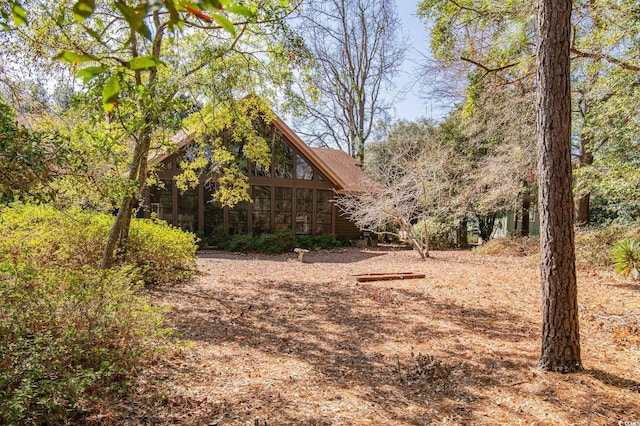 view of yard featuring a sunroom