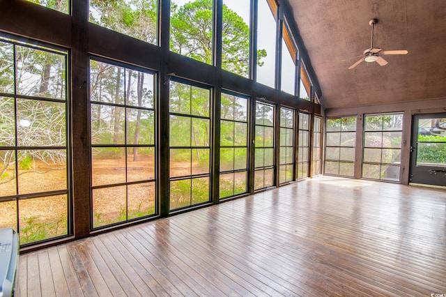 unfurnished sunroom featuring lofted ceiling and ceiling fan