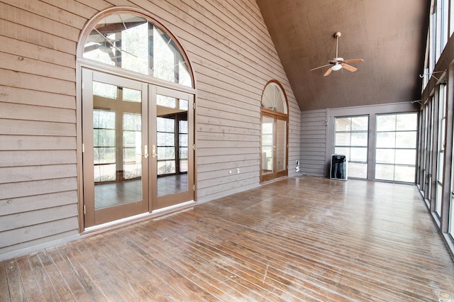 unfurnished sunroom featuring french doors, ceiling fan, and vaulted ceiling