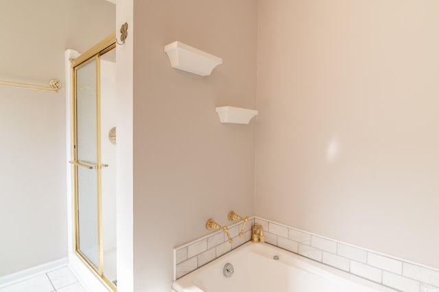 full bath featuring a garden tub, tile patterned floors, and a shower stall