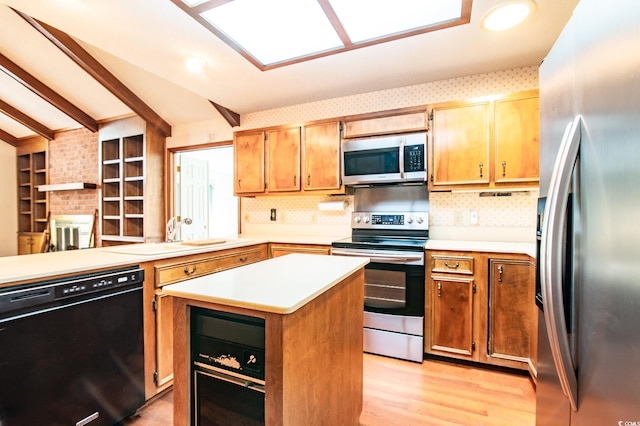 kitchen with beam ceiling, a sink, a kitchen island, stainless steel appliances, and light countertops