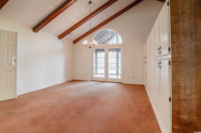 spare room with high vaulted ceiling, french doors, light carpet, beamed ceiling, and a notable chandelier