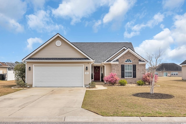 216 Camrose Way, Myrtle Beach, SC 29579 - view of front of house featuring driveway, a front yard, an attached garage, brick siding, and roof with shingles