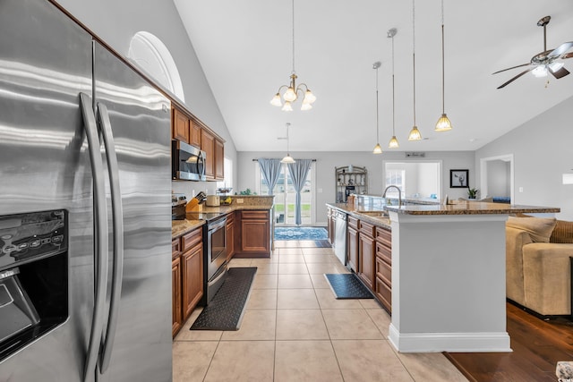 216 Camrose Way, Myrtle Beach, SC 29579 - kitchen with appliances with stainless steel finishes, open floor plan, light stone countertops, a ceiling fan, and high vaulted ceiling