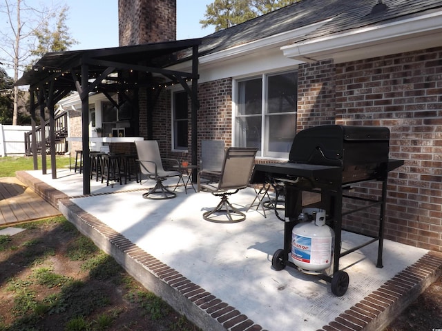 view of patio / terrace featuring a grill and outdoor dining area